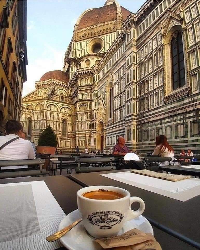 Espresso at café overlooking Italian cathedral
