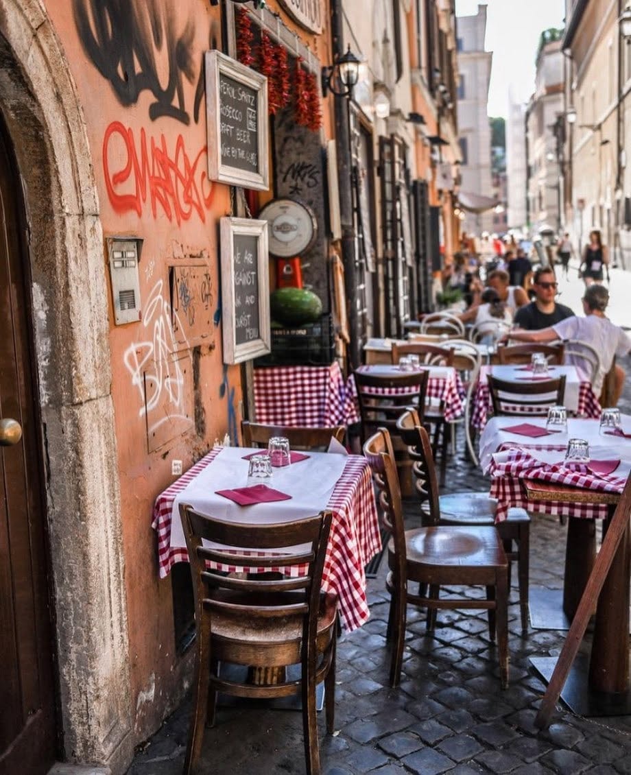 Roman street restaurant with checkered tablecloths